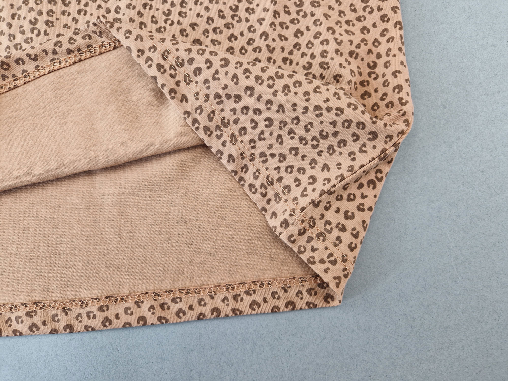 Stretchshirt langarm Gr. 122 H&M braun mit Muster